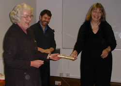 Professor Christian Kay and Dr John Corbett receiving a gift from Dr Lisa Lena Opas-Hänninen (University of Oulu, Finland)